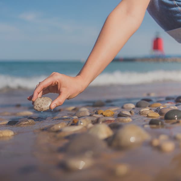 finding petoskey stones on Lake Michigan beach